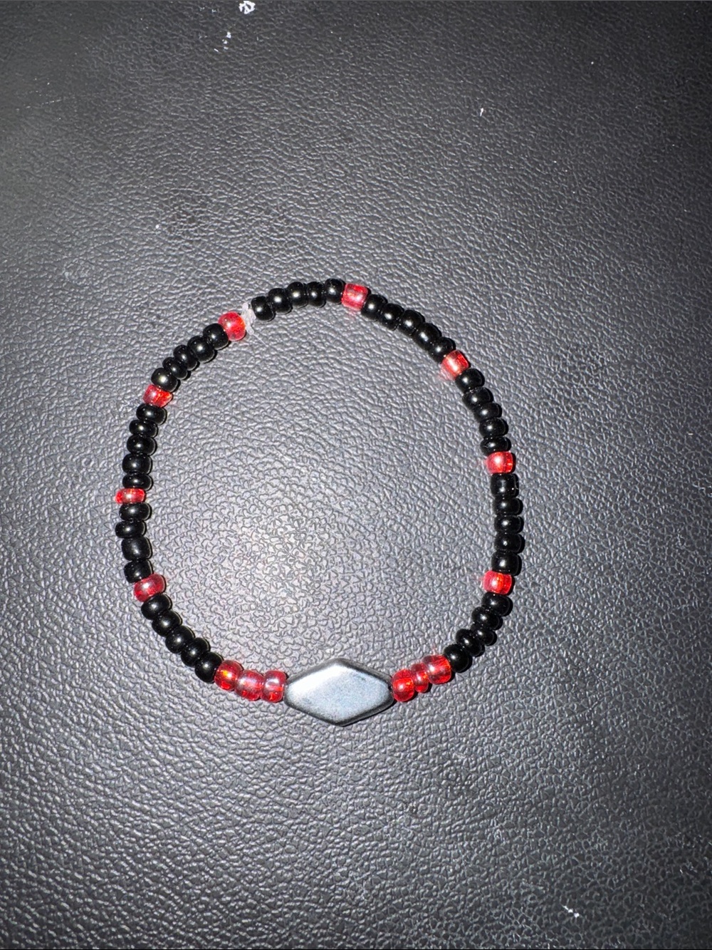 Black and Red Beaded Stretch Bracelet with Metallic Accent
